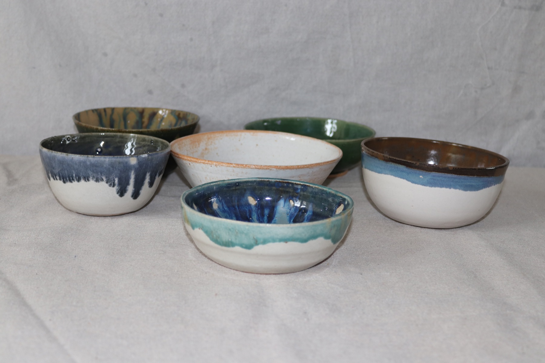A collection of handmade bowls from The Honest Potter studio