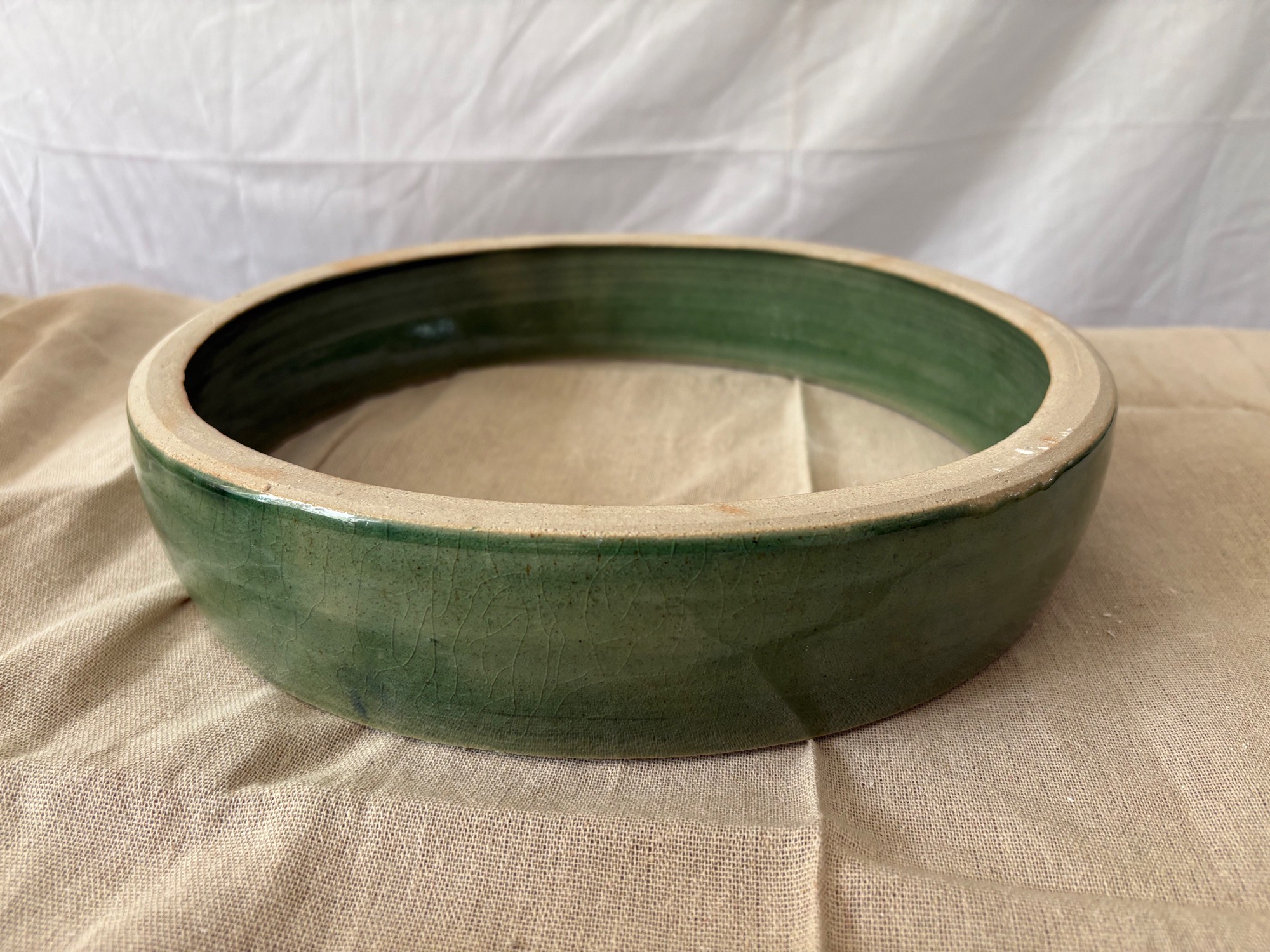 Glazed ceramic bodhran form before attaching a skin